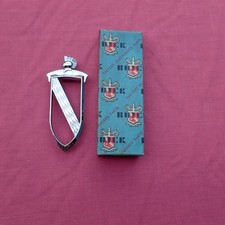 1957 Buick Roadmaster rear door emblem, NOS 1174251 ornament picture