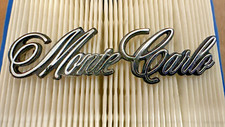 NOS 1973-1977 Chevrolet Monte Carlo Header Panel Emblem NOS 325272 GM OEM picture