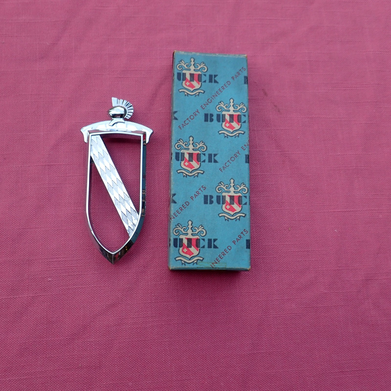 1957 Buick Roadmaster rear door emblem, NOS 1174251 ornament