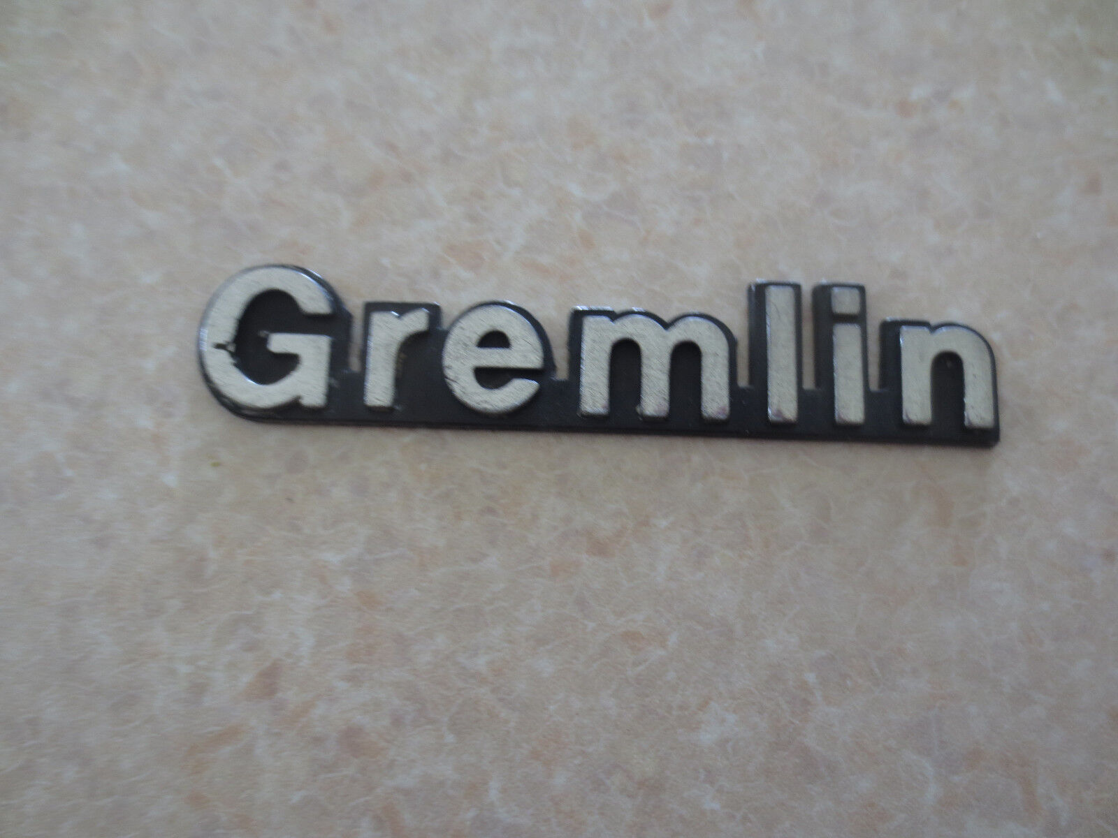   Original AMC Gremlin car badge 