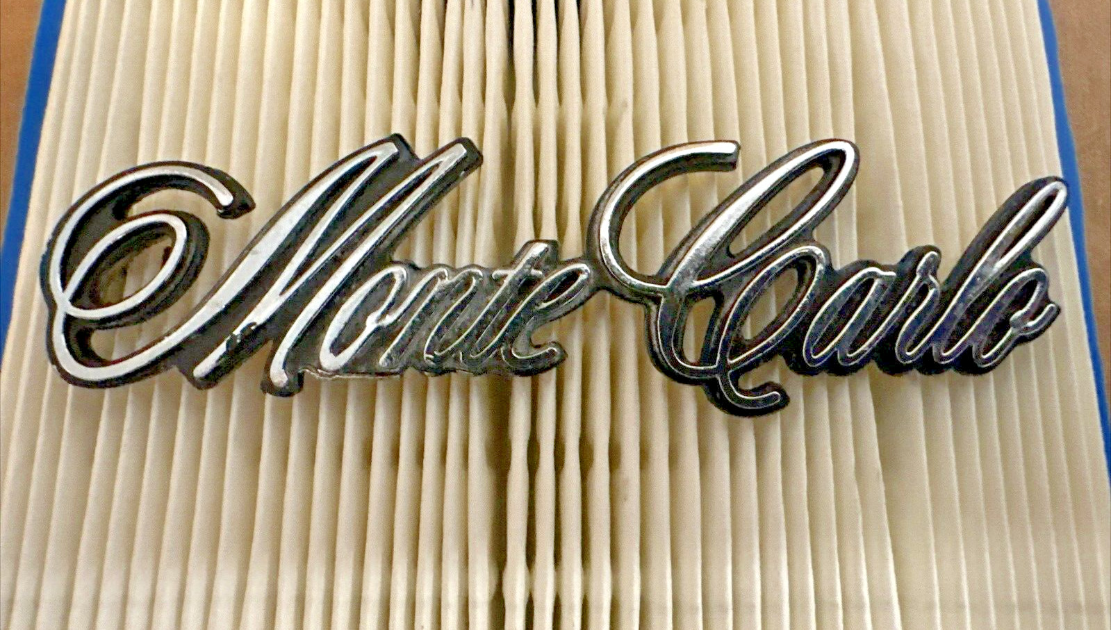 NOS 1973-1977 Chevrolet Monte Carlo Header Panel Emblem NOS 325272 GM OEM