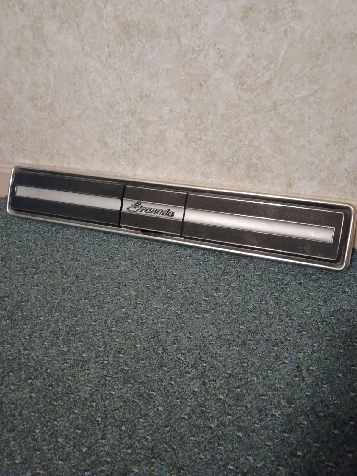 1978 FORD GRANADA -- REAR FINISH PANEL -- BETWEEN TAIL LIGHTS -- (GAS CAP COVER)